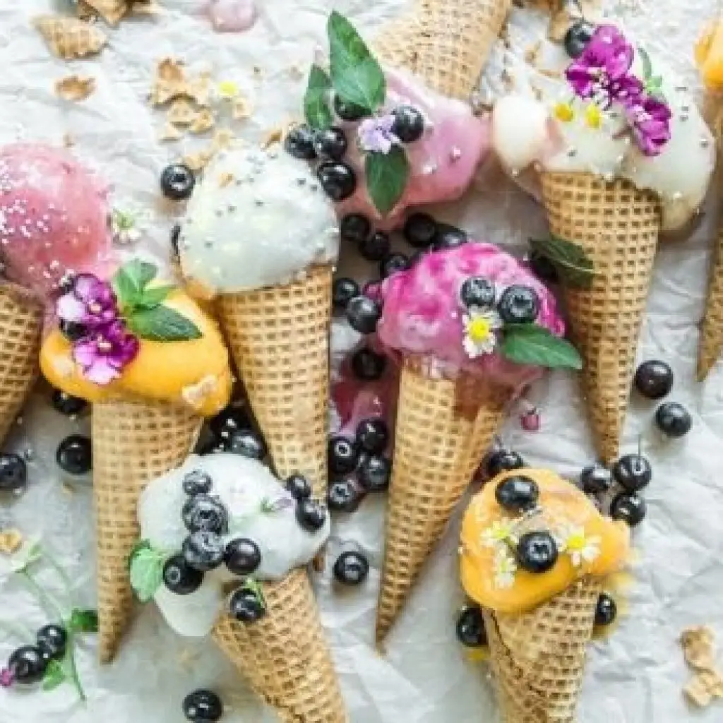 gelato cones decorated with fresh fruit and mint